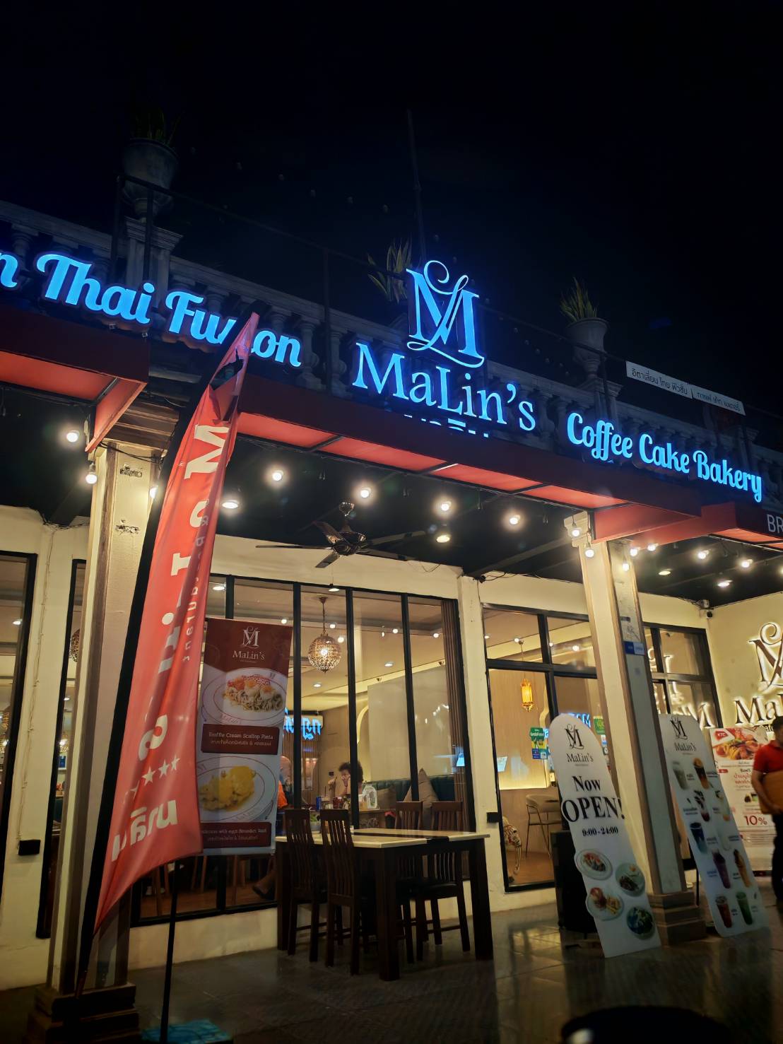 MaLin's Cafe exterior night view with blue neon signage